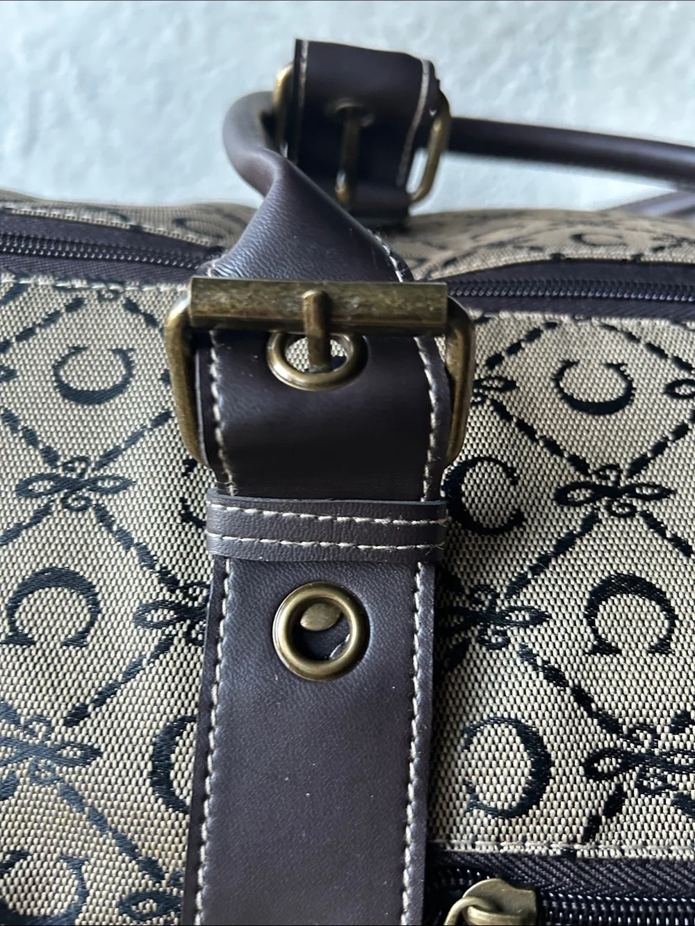 CIAO! 22” duffle bag with faux leather handles buckle
